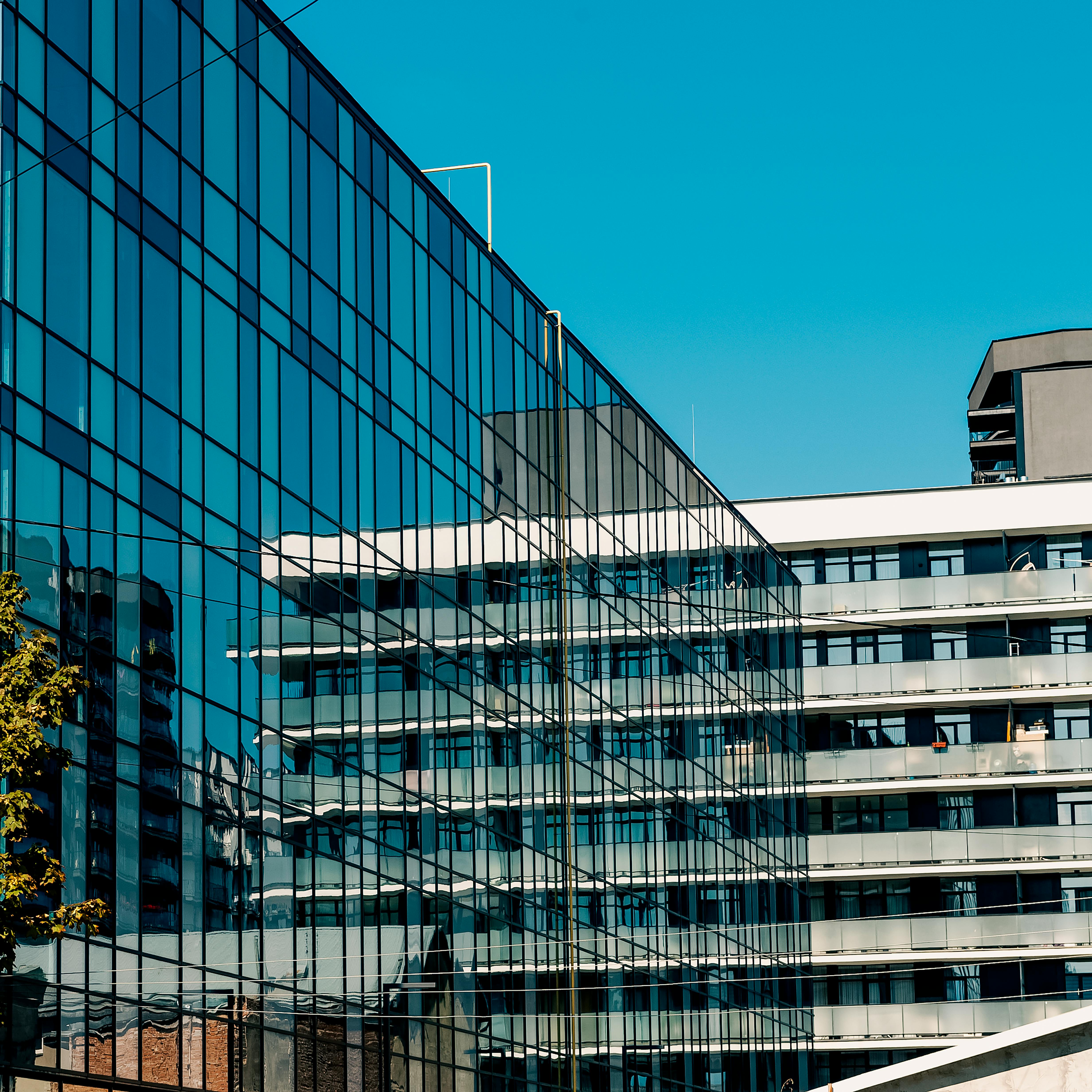 Reflective glass facade of a modern urban building showcasing contemporary architecture.